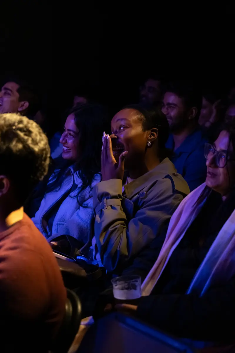 Audience reacting at the show