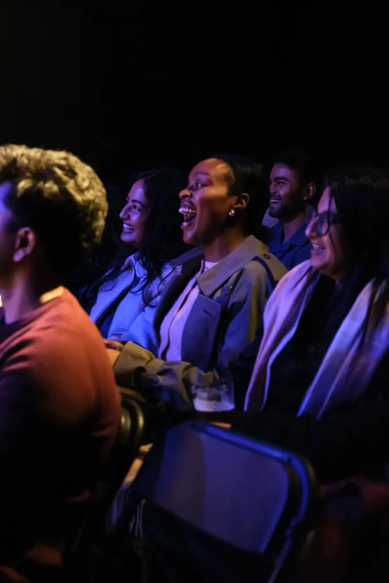 Audience members laughing