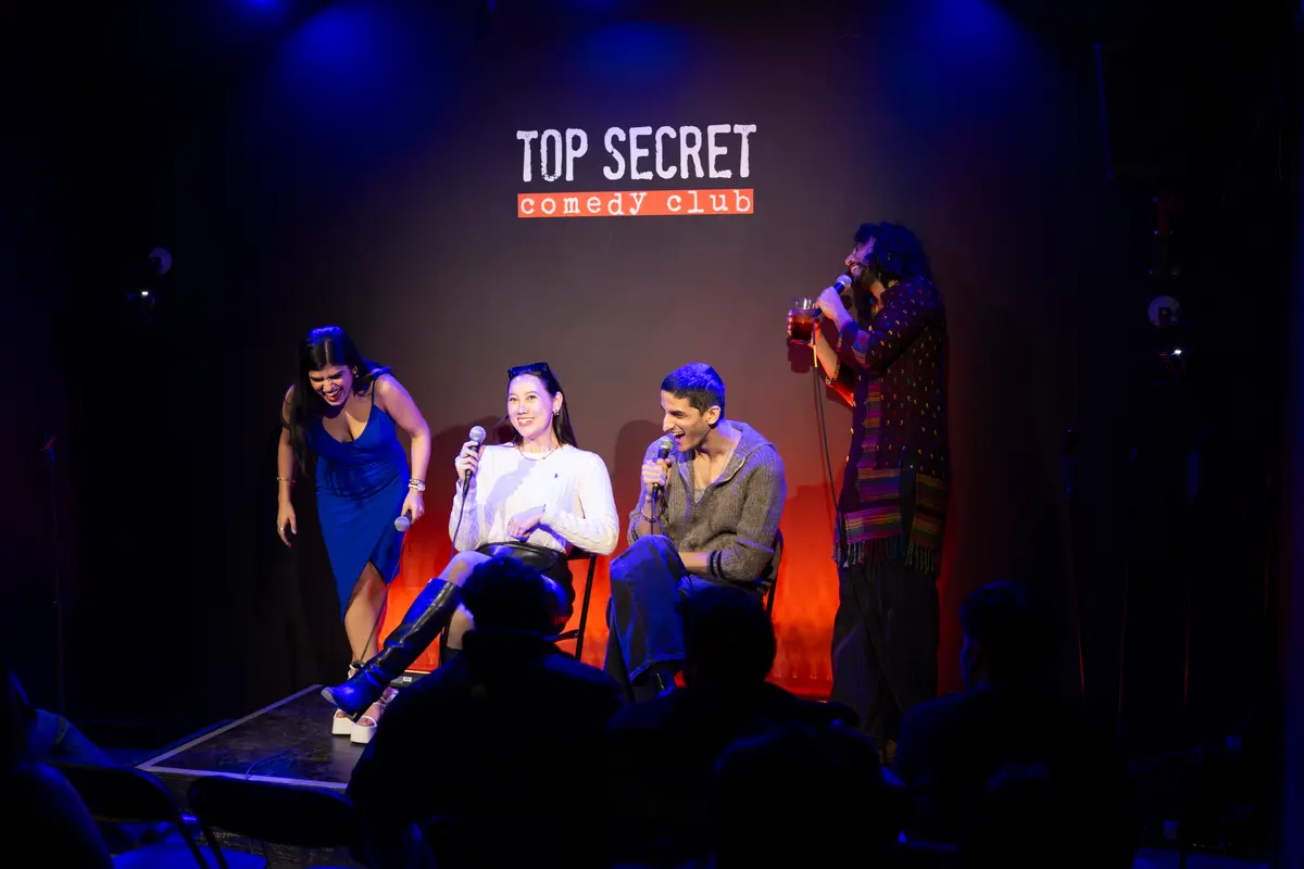 Matched couple laughing on stage